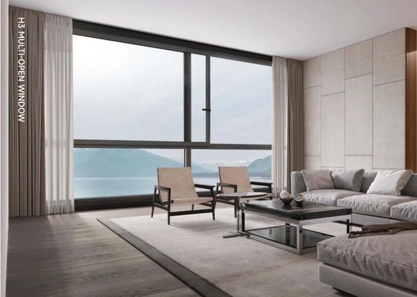 Modern living room with large multi-open window and mountain lake view.