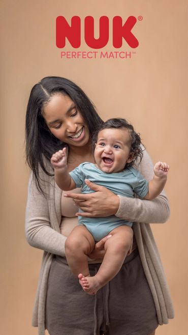Smiling mother holding happy baby under NUK Perfect Match logo.