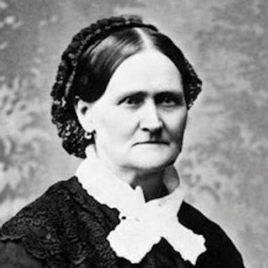 Black and white portrait of a serious elderly woman in Victorian attire.