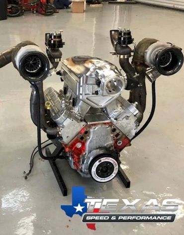High-performance V8 engine with dual turbochargers on display.