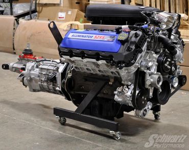 A high-performance Aluminator 52XS engine on a stand in a workshop.