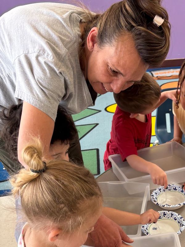 Ms. Celeste helping during a STEAM activity in our preschool.