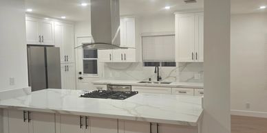 Contemporary Kitchen with gray cabinets, quartz counter top