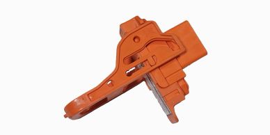 Orange plastic mechanical component against white background.