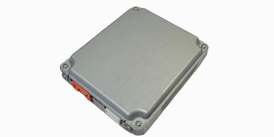 Rectangular metal enclosure with orange connector.