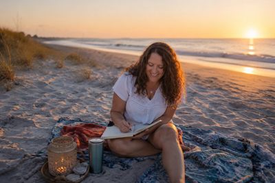Bestselling author Lori Hayes in her beach lifestyle writing beach reads and romance