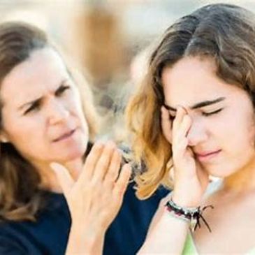 A mother scolding her distressed daughter.