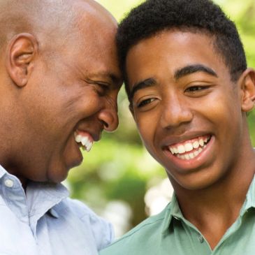 Father and son sharing a joyful moment together.