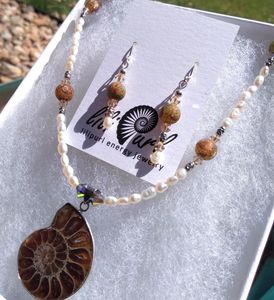 Jewelry set with fossil pendant and matching earrings.