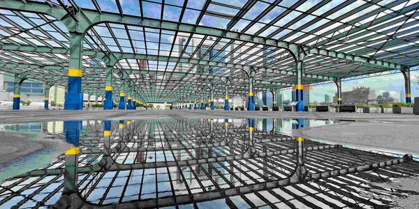 Empty open-air metal structure reflected in water on the ground.