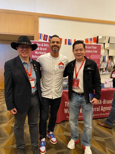 Three men posing at an ERA event.