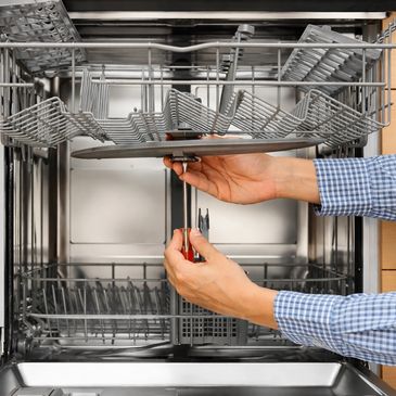 Dishwasher repair technician fixing dishwasher in Concord