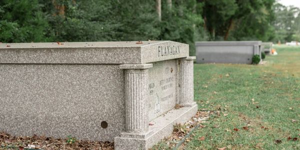 Granite tombstone with the name Flanagan.