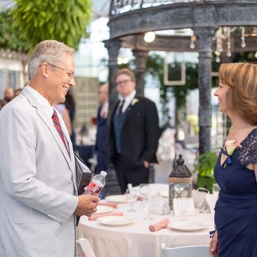 Glen Cook, Utah wedding officiant at reception with mother of groom. 