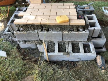 Construction foundation with cinder blocks and bricks.