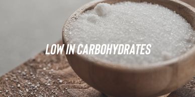 Close-up of a bowl filled with coarse grains labeled low in carbohydrates.