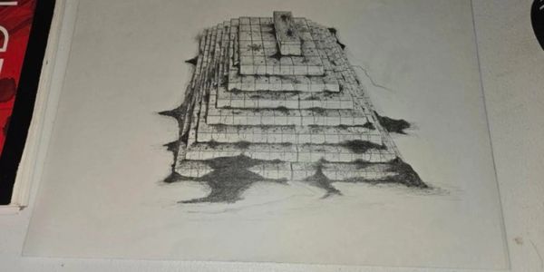 3D drawing of a stone pyramid on paper.