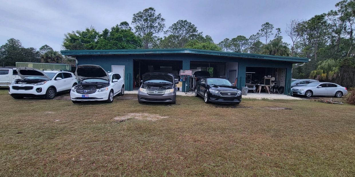 Exterior view of Your Automotive Solution auto repair shop in Naples, FL with multiple service bays 