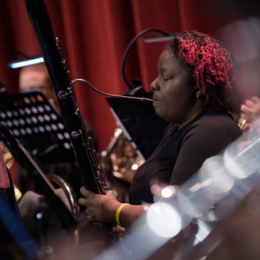 Woman playing bassoon.