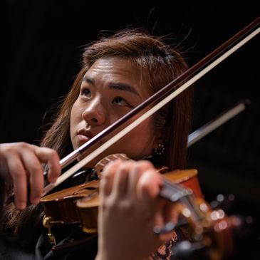 Woman playing violin.