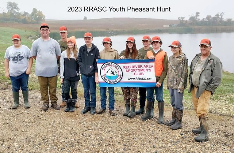 Young hunters are seen with landowner Chuck Haus.