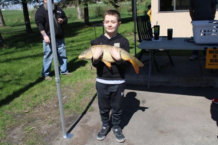 Adam Agayev with the fish he caught. Adam Agayev with the fish he caught.