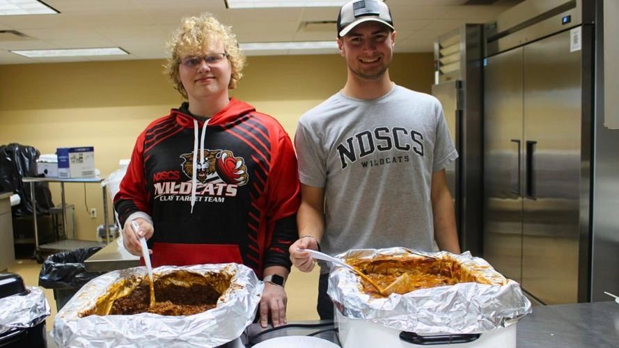 Volunteers Jeremiah Dampie, on left, and Casey Erovick served the food. Volunteers Jeremiah Dampie, on left, and Casey Erovick served the food.