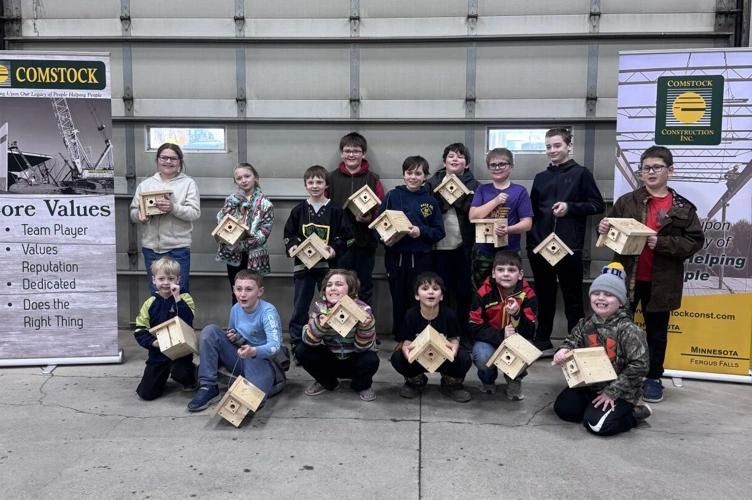 The Red River Area Sportsmen's Club Junior Wildlife Club members hold the wren houses they made. The Red River Area Sportsmen's Club Junior Wildlife Club members hold the wren houses they made.