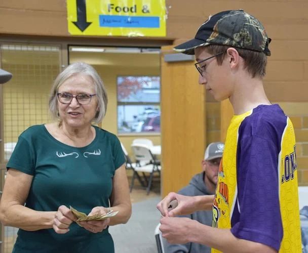 Denise Herding and Wyatt Longhenry, 15, a member of Wahpeton’s trap team, teamed up to collect money and distribute the playing cards for a 50-50 raffle. Guests responded enthusiastically to the cause.