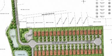Site plan with numbered lots and green spaces.