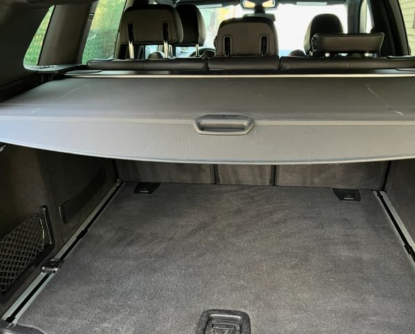 Empty car trunk with cover.