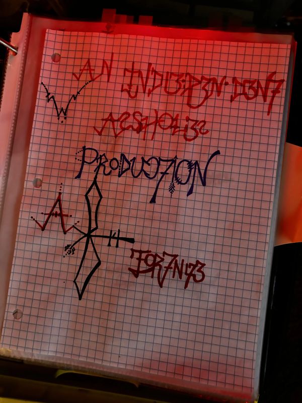 Graph paper with artistic handwritten text and symbols in red and blue ink.