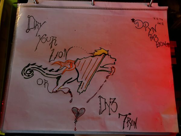 Artistic drawing of a lion with flames and stylized text.