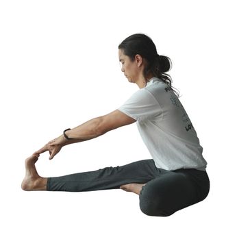 Guy seated in single leg forward fold