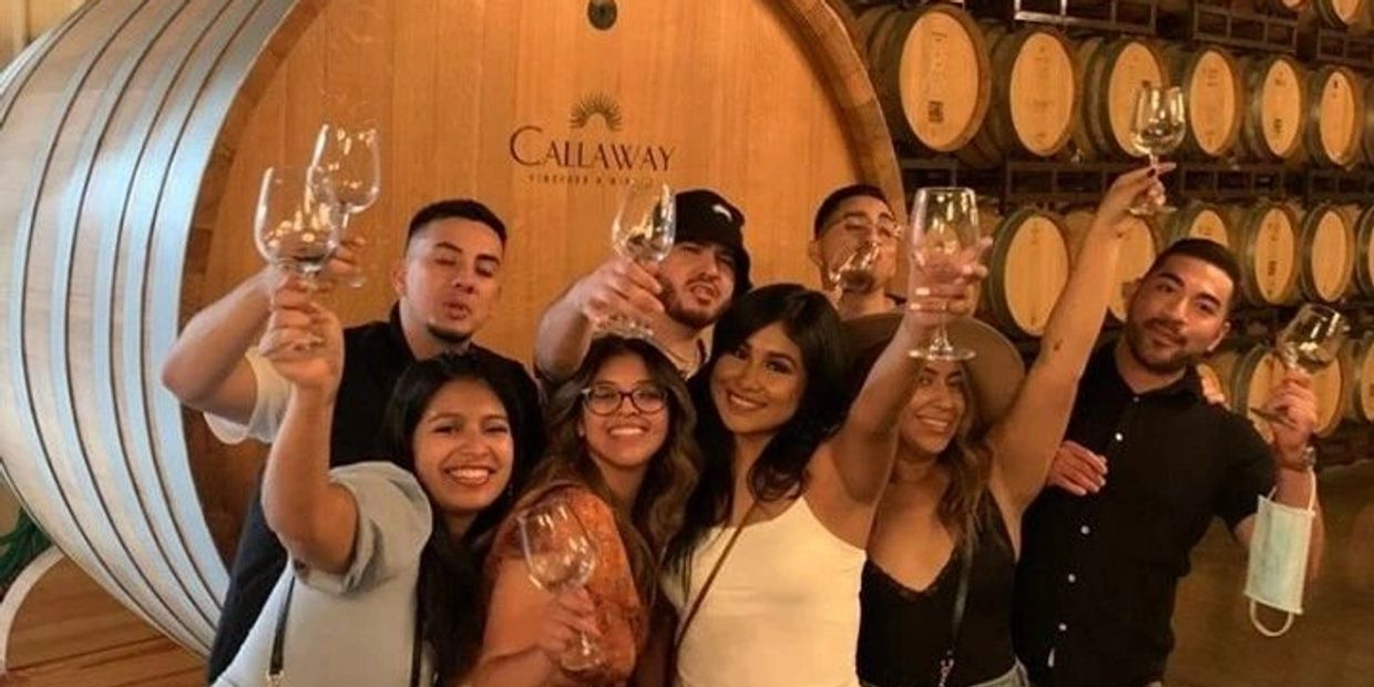 Guests toasting while on a barrelroom tour.