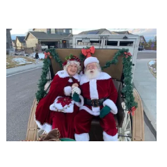 Santa and Mrs. Claus sitting in their sleigh!