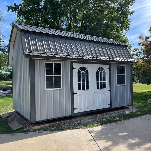 Lofted Barn Style Storage Shed with Double Fiberglass Doors with Arched Lites and 24" x 27" Slider W