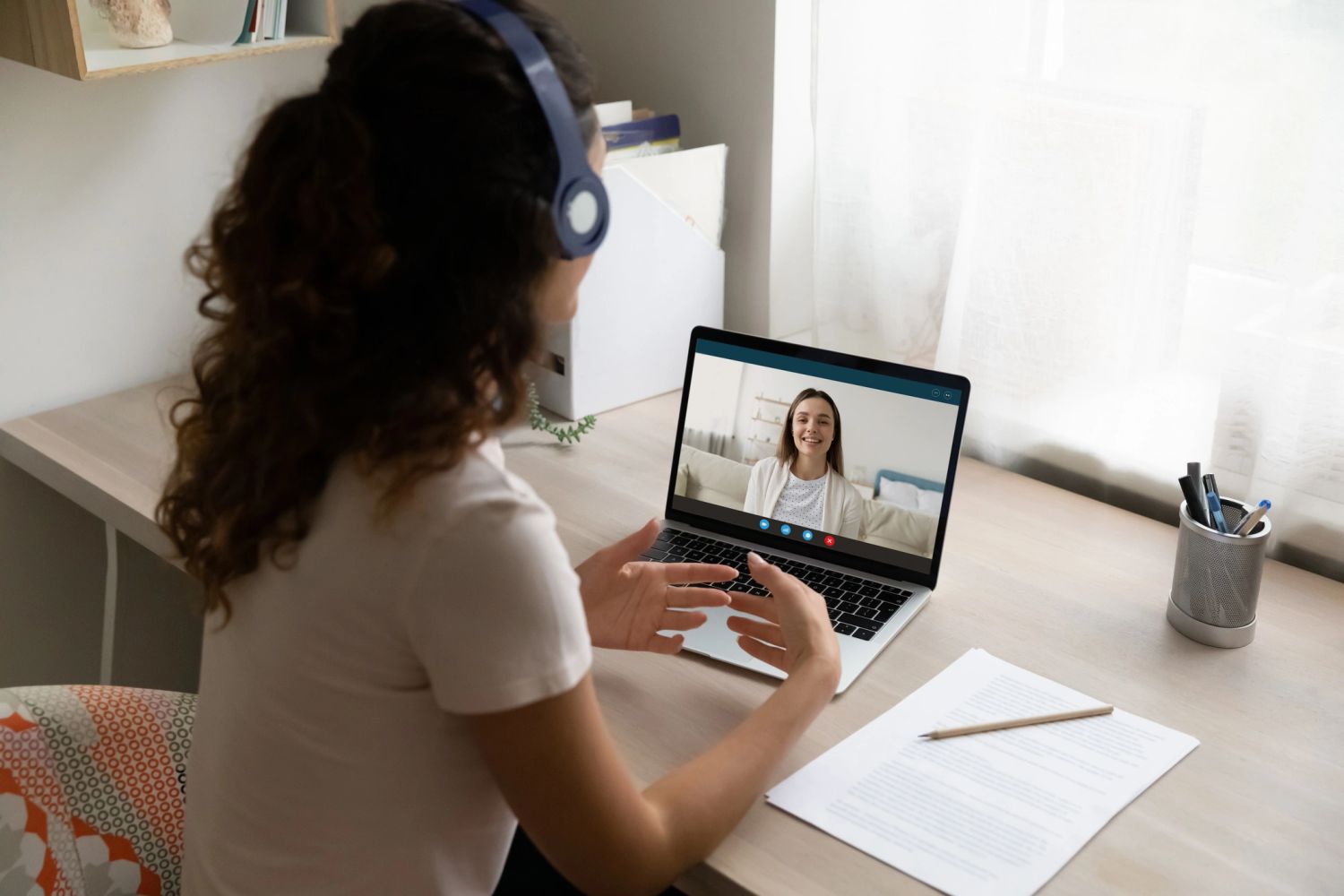 Student learning English via laptop.