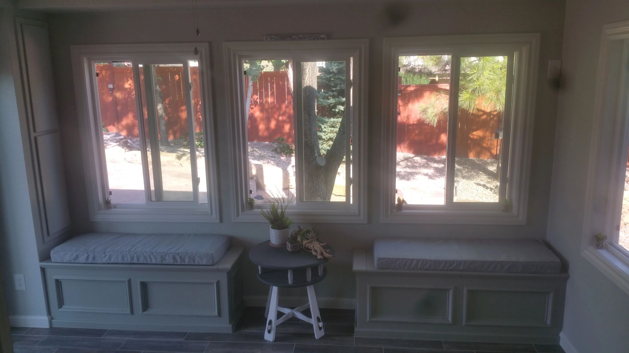 Exterior porch enclosed for sitting, relaxing, and dog cleaning/grooming. 