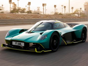 Teal coloured Aston Martin Valkyrie in motion