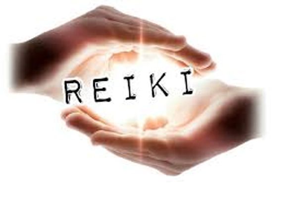 Reiki energy healing hands used in spiritual workshops and moon manifestation sessions 