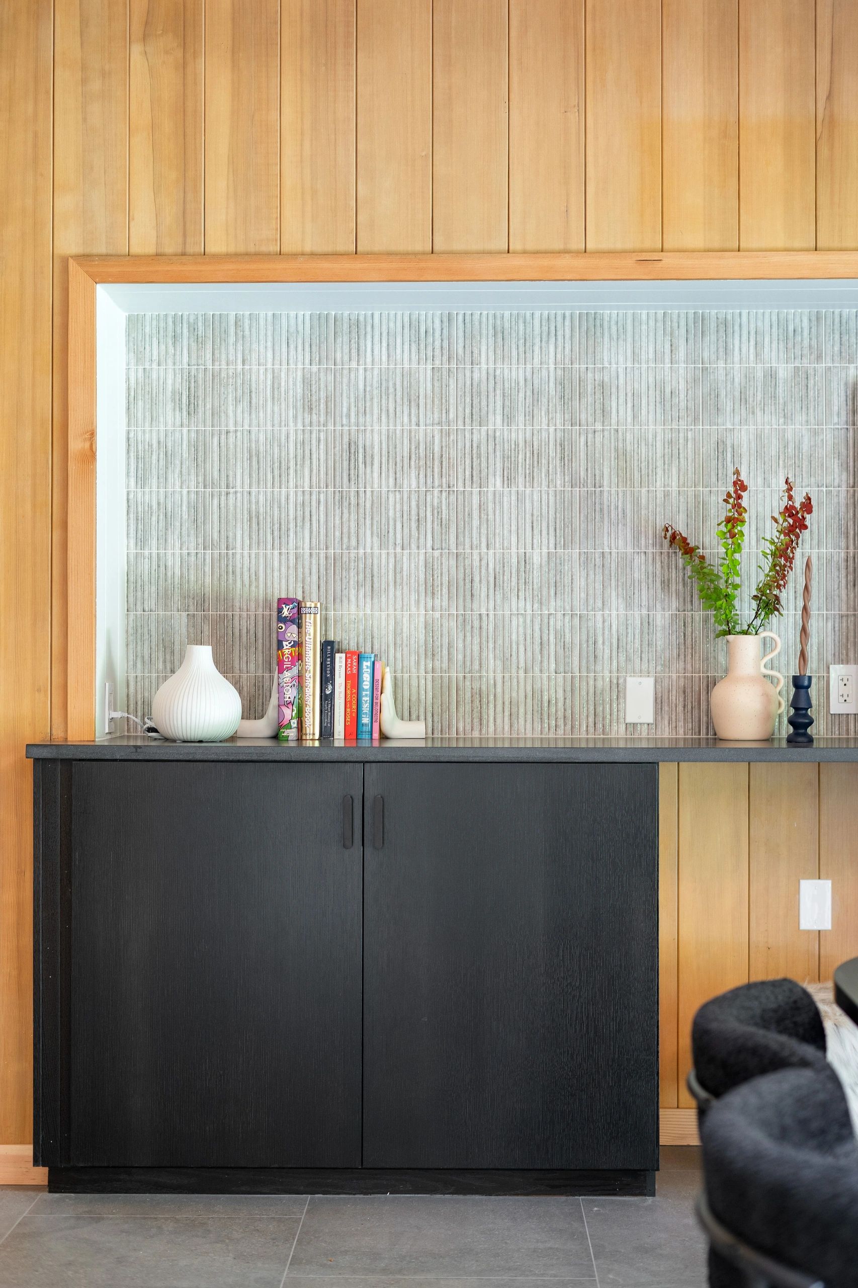 Modern shelf with books and vases
