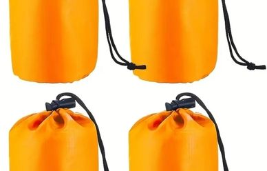Bright orange waterproof dry bags with black drawstrings in various sizes.