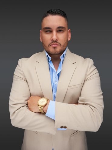 Studio headshot of Houston businessman in tan suit — confident branding portrait