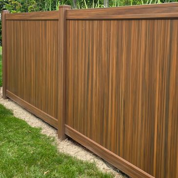 Homeland Vinyl Mocha walnut. Wood grain fence. Vinyl Fence. Homewood color. 