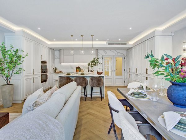 Bright open-concept kitchen and dining area with modern design and natural accents.
