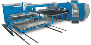 Automated industrial machine for cutting or processing materials.
