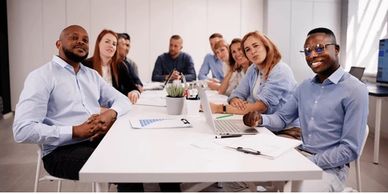 Diverse team having a meeting around a conference table.