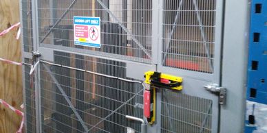 The interlocked gate of a mezzanine goods lift at a West London site.