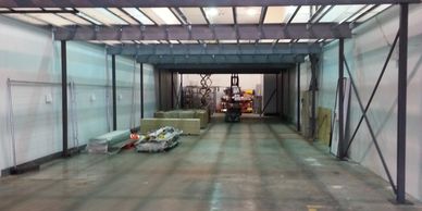 A braced office mezzanine floor with a large clear span being assembled in a coldstore in Surrey.